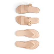 Set of beige sandals with a buckle on a white background made by using a pattern