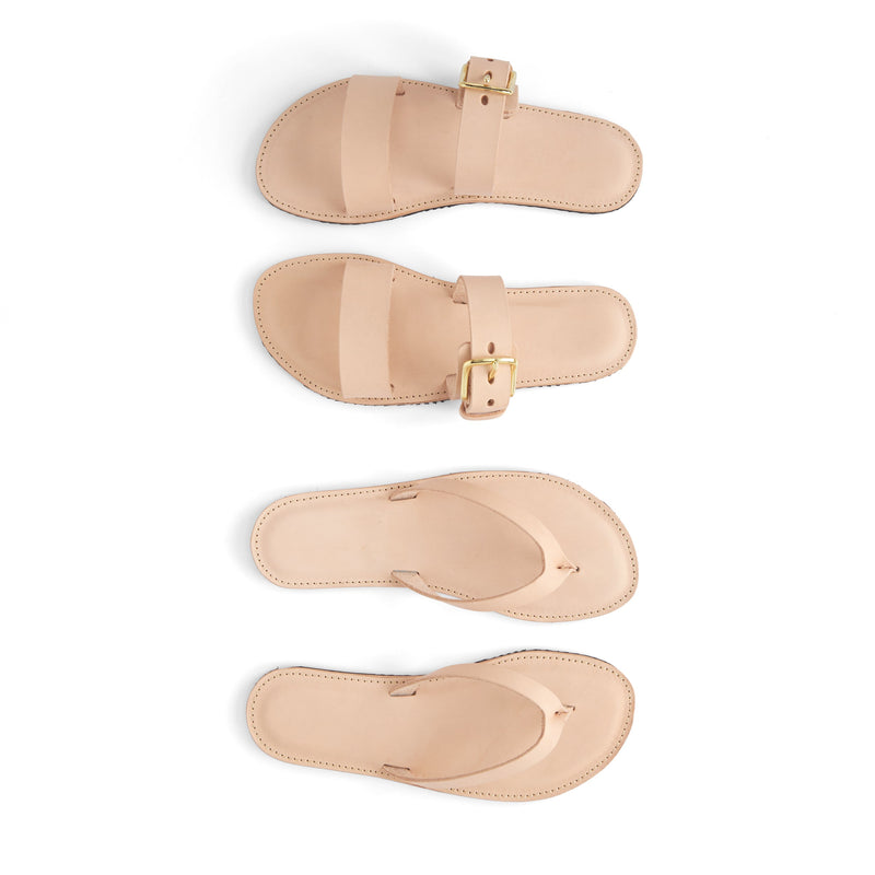 Set of beige sandals with a buckle on a white background made by using a pattern