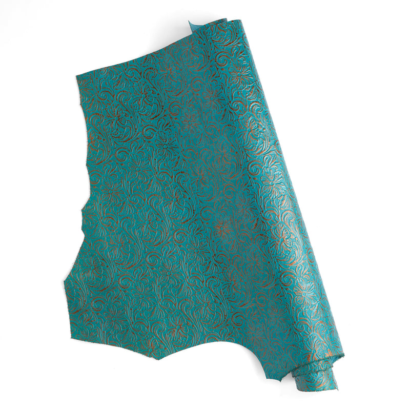 Turquesa metálico con relieve floral y un solo hombro